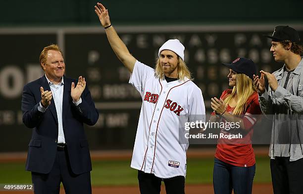 Olympic gold medalist Sage Kotsenburg waves before throwing out the first pitch before a game with Tampa Bay Rays at Fenway Park on September 22,...