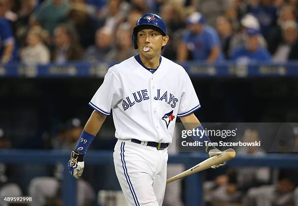 Munenori Kawasaki of the Toronto Blue Jays reacts after being called out on strikes in the fifth inning during MLB game action against the New York...