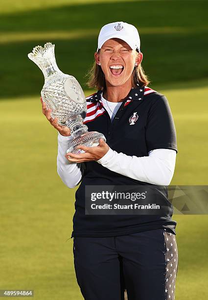 Angela Stanford of team USA holds the Solheim Cup trophy after the final day of The Solheim Cup at St Leon-Rot Golf Club on September 20, 2015 in St...