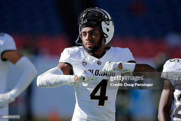 Chidobe Awuzie of the Colorado Buffaloes warms up prior to facing the Colorado State Rams during the Rocky Mountain Showdown at Sports Authority...