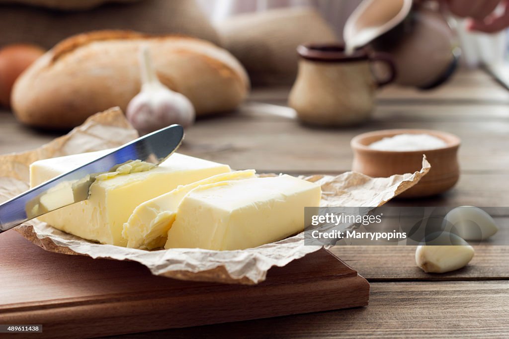 Butter knife , bread , garlic and milk