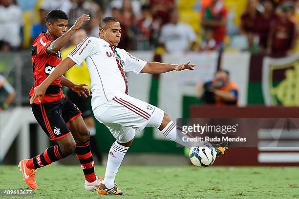 Walter of Fluminense struggles for the ball with Marcio Araujo of Flamengo during a match between Fluminense and Flamengo as part of Brasileirao...