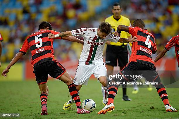 Rafael Sobis of Fluminense battles for the ball with Caceres and Samir of Flamengo during the match between Fluminense and Flamengo as part of...