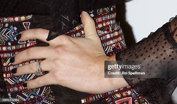 Actress Anne Hathaway, jewelry detail, attends the The Cinema Society and Ruffino host a screening of Warner Bros. Pictures' "The Intern" at the...