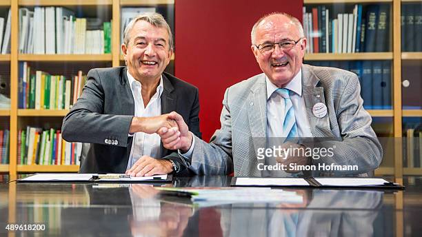 President Wolfgang Niersbach and Heinz Hilgers, President of Child Protection Association, shake hands after signing a contract at DFB Headquarters...