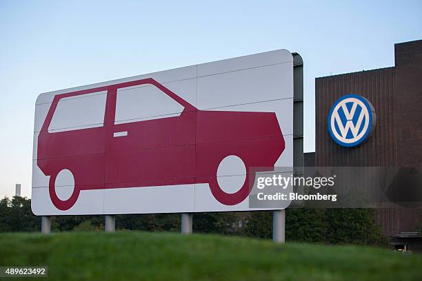 The VW logo sits on the exterior of the Volkswagen AG headquarters in Wolfsburg, Germany, on Wednesday, Sept. 23, 2015. Volkswagen's escalating...