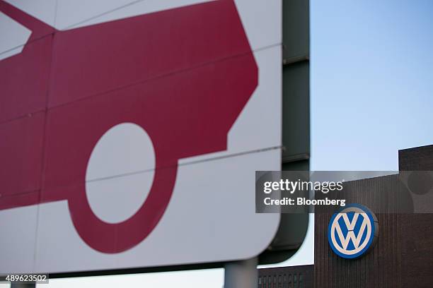 The VW logo sits on the exterior of the Volkswagen AG headquarters in Wolfsburg, Germany, on Wednesday, Sept. 23, 2015. Volkswagen's escalating...