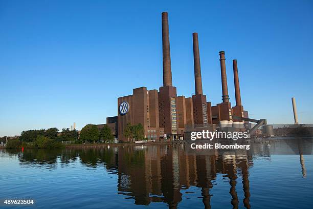 Logo sits on display outside the power plant at the Volkswagen AG headquarters in Wolfsburg, Germany, on Wednesday, Sept. 23, 2015. Volkswagen's...