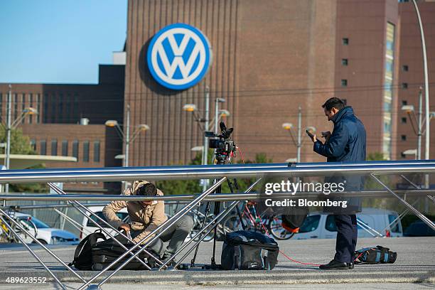 Television news crew sets up their camera equipment outside the Volkswagen AG headquarters in Wolfsburg, Germany, on Wednesday, Sept. 23, 2015....