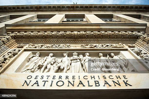 Relief stands above the entrance of the headquarters of the Austrian central bank, also known as the Oesterreichische Nationalbank , in Vienna,...