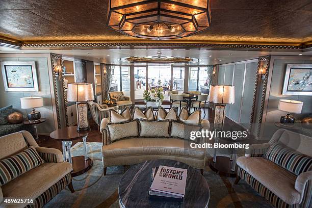 Sofas and armchairs sit in a lounge area aboard the luxury superyacht Solandge, built by Lurssen Werft GmbH & Co. KG, during the Monaco Yacht Show in...