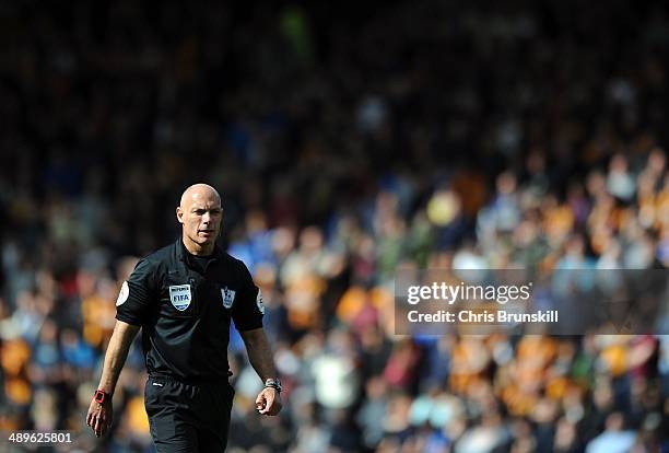 Referee Howard Webb looks on during the Barclays Premier League match between Hull City and Everton at the KC Stadium on May 11, 2014 in Hull,...