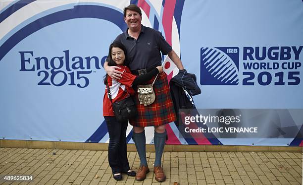 Scotland and Japan rugby fan pose outside the stadium ahead of the Pool B match of the 2015 Rugby World Cup between Scotland and Japan at Kingsholm...