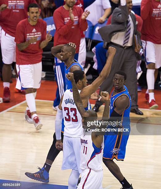 Los Angeles Clippers Danny Granger and Jamal Crawford celebrate as Oklahoma City Thunder Serge Ibaka and Reggie Jackson react after the Clippers...