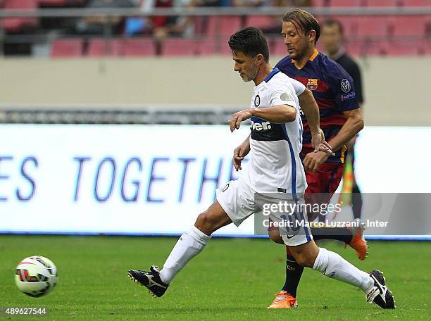 Benito Carbone of Inter Forever is challenged by Gaizka Mendieta Zabala of Barcelona during the The 2015 Winning League International Legends...