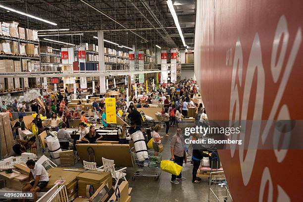Customers wait in line to checkout at an Ikea store in the Brooklyn borough of New York, U.S., on Saturday, Sept. 19, 2015. The U.S. Census Bureau is...