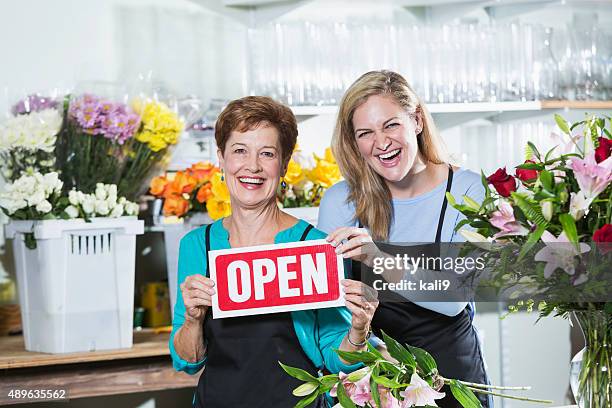 women in flower shop open for business - kali rose stock pictures, royalty-free photos & images