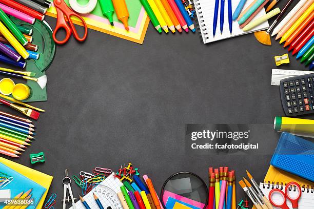 school supplies border on black chalkboard - kontorstillbehör bildbanksfoton och bilder