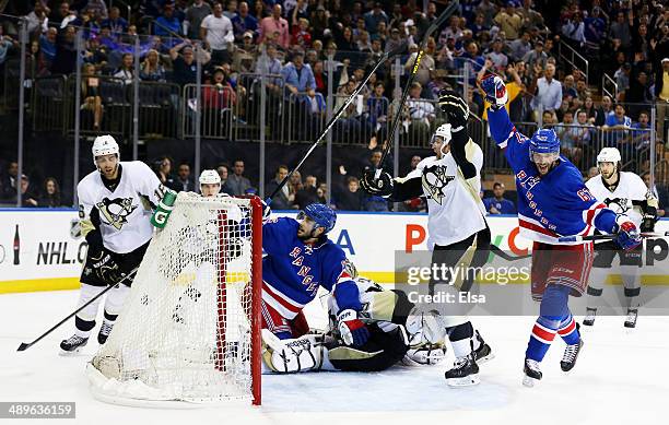 Derick Brassard of the New York Rangers celebrates his goal with teammate Benoit Pouliot in the second period against the Pittsburgh Penguins during...