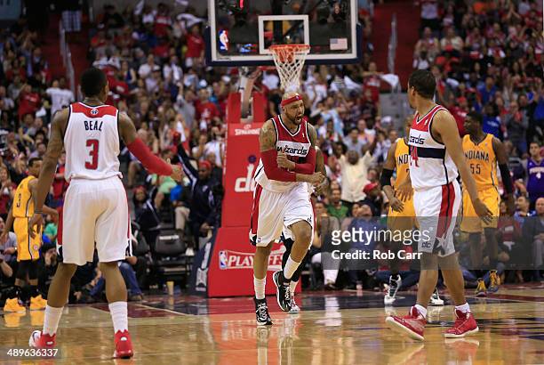 Drew Gooden of the Washington Wizards celebrates after scoring against the Indiana Pacers during the first half of Game Four of the Eastern...
