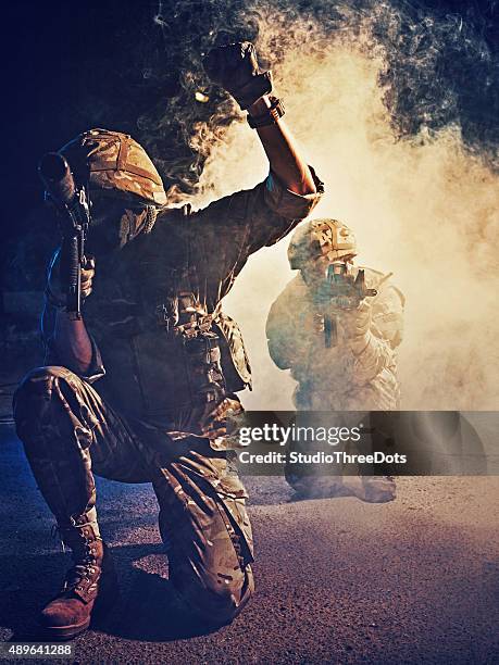 two soldiers in action - military rescue stock pictures, royalty-free photos & images