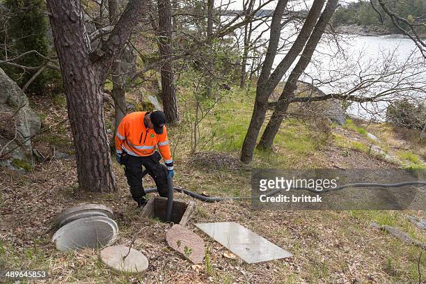 boat to collects sewer from septic tank in stockholm archipelago - septic tank stock pictures, royalty-free photos & images