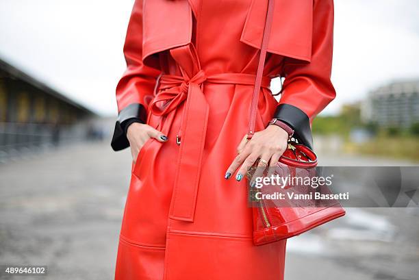 Paris Wang poses with a Louis Vuitton bag before the Gucci show during the Milan Fashion Week Spring/Summer 16 on September 23, 2015 in Milan, Italy.