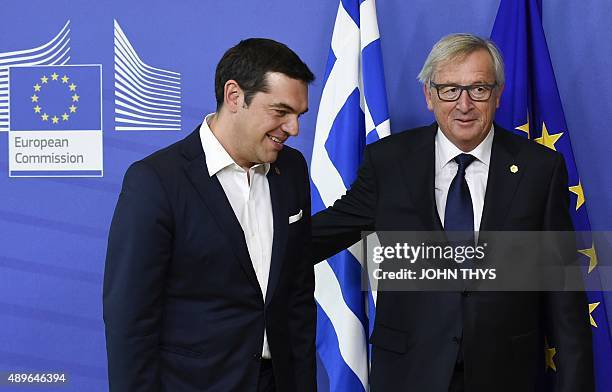 European Commission President Jean-Claude Juncker welcomes Greek Prime Minister Alexis Tsipras on September 23, 2015 before to their bilateral...