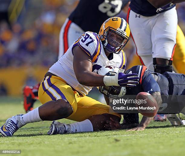 Frank Herron of the Louisiana State University Tigers causes and recovers a fumble against Jeremy Johnson of the Auburn University Tigers at Tiger...