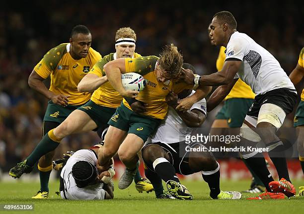 Michael Hooper of Australia crashes into Netani Talei of Fiji during the 2015 Rugby World Cup Pool A match between Australia and Fiji at Millennium...