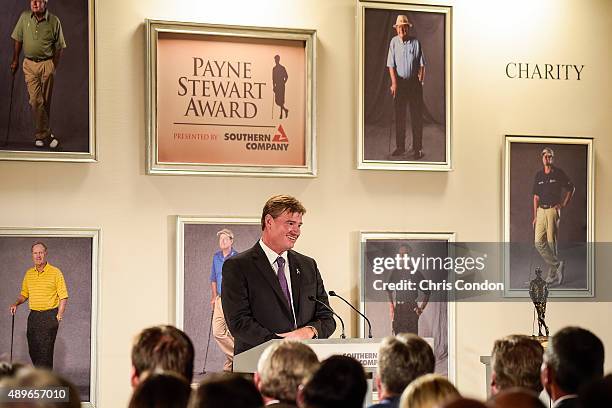 Ernie Els of South Africa speaks after receiving the Payne Stewart Award at a ceremony held following practice for the TOUR Championship by...