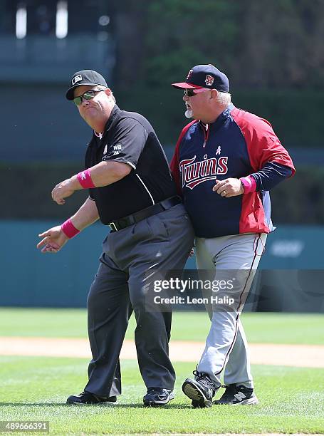 Major League Umpire Joe West ejects Minnesota Twins manage Ron Gardenhire out of the game during the bottom of the forth inning of the game against...