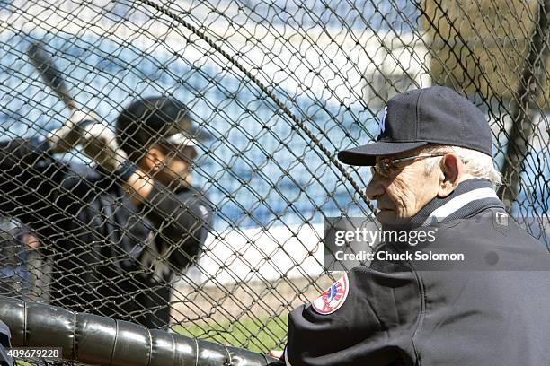 Hall of Famer and former New York Yankees catcher Yogi Berra watching Jesus Montero during batting practice before spring training game vs...