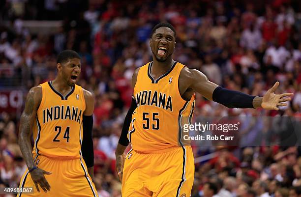 Roy Hibbert of the Indiana Pacers and teammate Paul George celebrate after Hibbert scored a basket late in the fourth quarter of the Pacers 95-92 win...