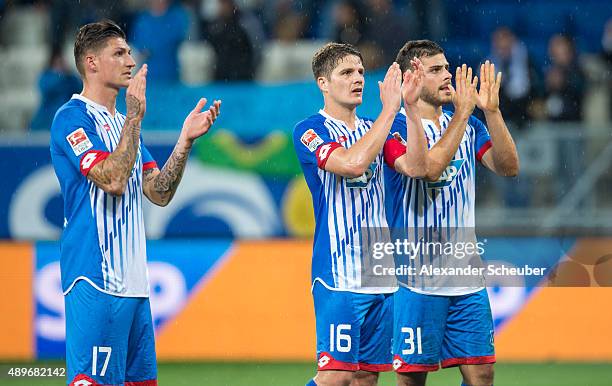 Steven Zuber of Hoffenheim, Pirmin Schwegler of Hoffenheim and Kevin Volland of Hoffenheim say thank you to the fans after the bundesliga match...