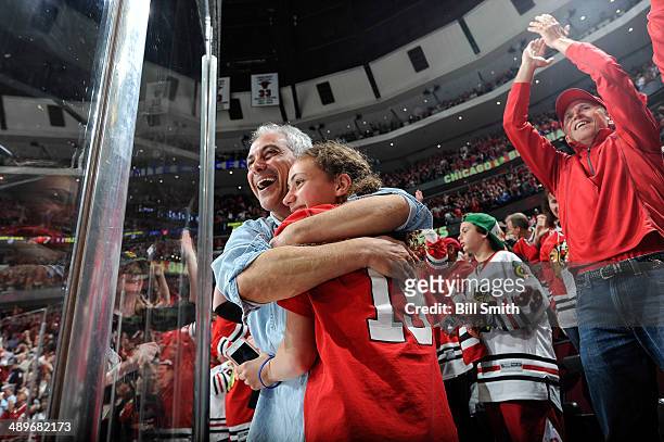 Chicago mayor, Rahm Emanuel, hugs his daughter Ilana after the Chicago Blackhawks scored in the third period to pull ahead of the Minnesota Wild in...