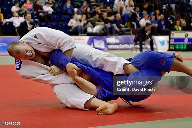 Chris Sherrington of Great Britain attempts to armlock Luca Marmo of Italy during their o100kg bronze medal match won by Sherrington during the...