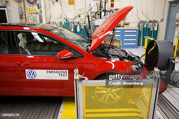 Red 2016 Volkswagen AG Golf TDI emissions certification vehicle waits to be tested inside the California Air Resources Board Haagen-Smit Laboratory...