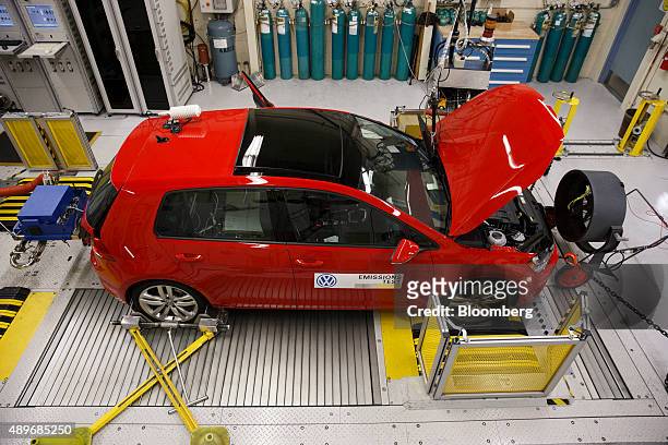 Red 2016 Volkswagen AG Golf TDI emissions certification vehicle waits to be tested inside the California Air Resources Board Haagen-Smit Laboratory...