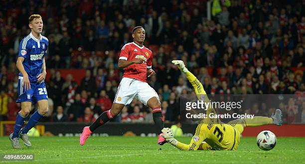 Anthony Martial of Manchester United scores his team's third goal past Bartosz Bialkowski of Ipswich Town during the Capital One Cup Third Round...