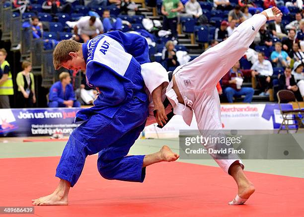 Maximillian Schneider of Austria throws Benjamin Muennich of Germany for a yuko to win their u81kg repercharge match during the London British Open...