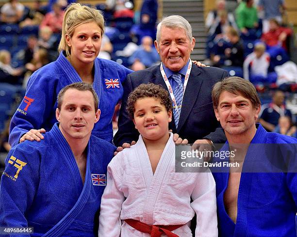 Louie, centre, who is completely blind stands with , Gemma Gibbons and George Kerr CBE and front row, Euan Burton and Ray Stevens after his "Beat a...