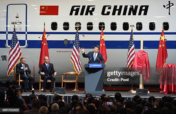 Chinese President Xi Jinping speaks beside Ray Conner , President and CEO of the Boeing Commercial Airplanes and Dennis Muilenburg , President and...