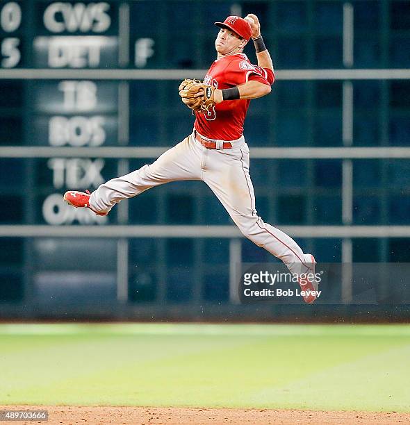 Taylor Featherston of the Los Angeles Angels of Anaheim attempts to throw out Matt Duffy of the Houston Astros in the seventh inning at Minute Maid...