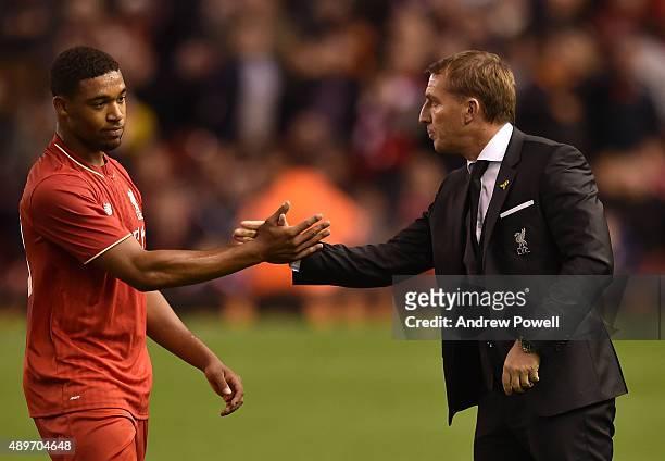 Jordon Ibe of Liverpool shakes hands with Brendan Rodgers manager of Liverpool during the Capital One Cup third round match between Liverpool and...