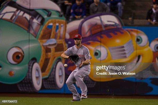 Brennan Boesch of the Cincinnati Reds fields a ground ball against the San Francisco Giants during the first inning at AT&T Park on September 14,...