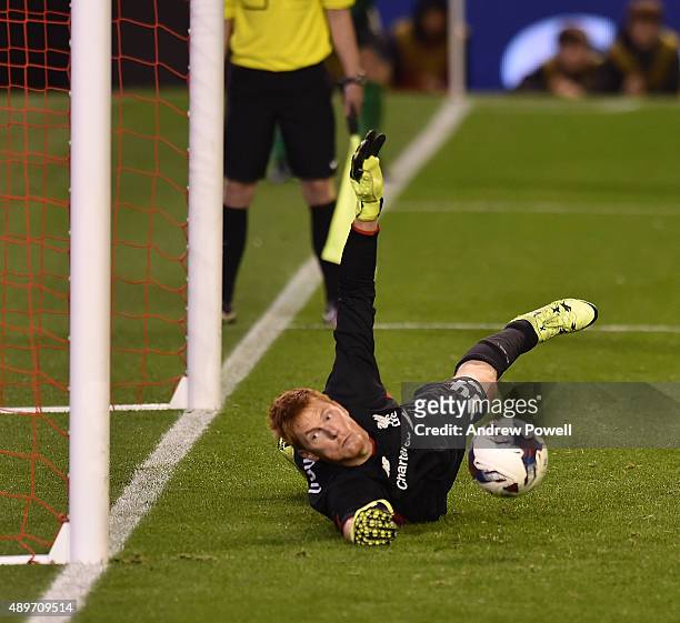 Adam Bogdan of Liverpool saves a penalty from Bastien Henry of Carlisle United to win the game during the Capital One Cup third round match between...