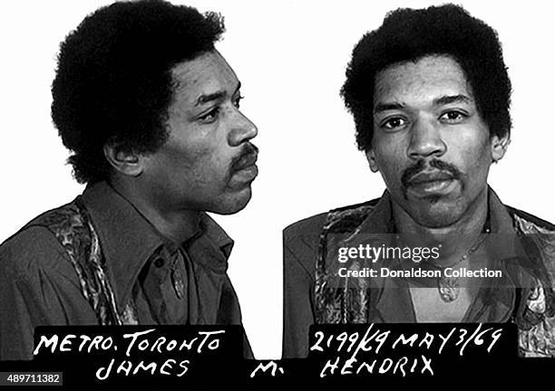 Rock star Jimi Hendrix poses for a mugshot after his arrest for narcotics possession at Toronto International Airport on May 3, 1969 in Toronto,...