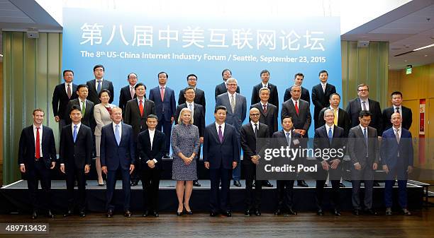Chinese President Xi Jinping poses for a photo with a group of CEOs and other executives at the main campus of Microsoft Corp. September 23, 2015 in...