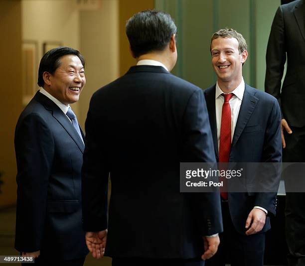 Chinese President Xi Jinping talks with Facebook Chief Executive Mark Zuckerberg as Lu Wei, China's Internet czar, looks on during a gathering of...